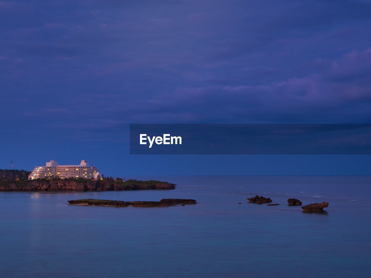 Scenic view of sea against sky at dusk