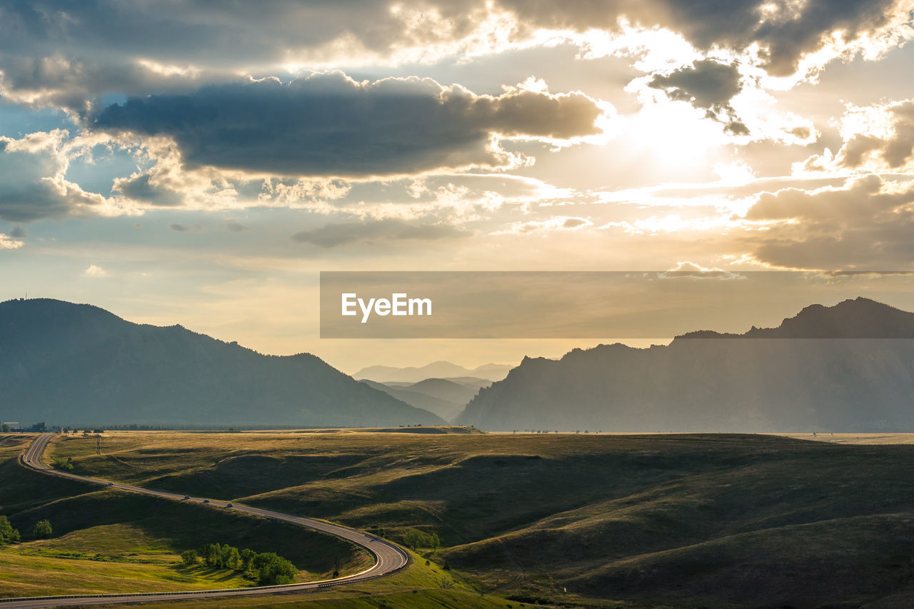 Scenic view of landscape against sky during sunset