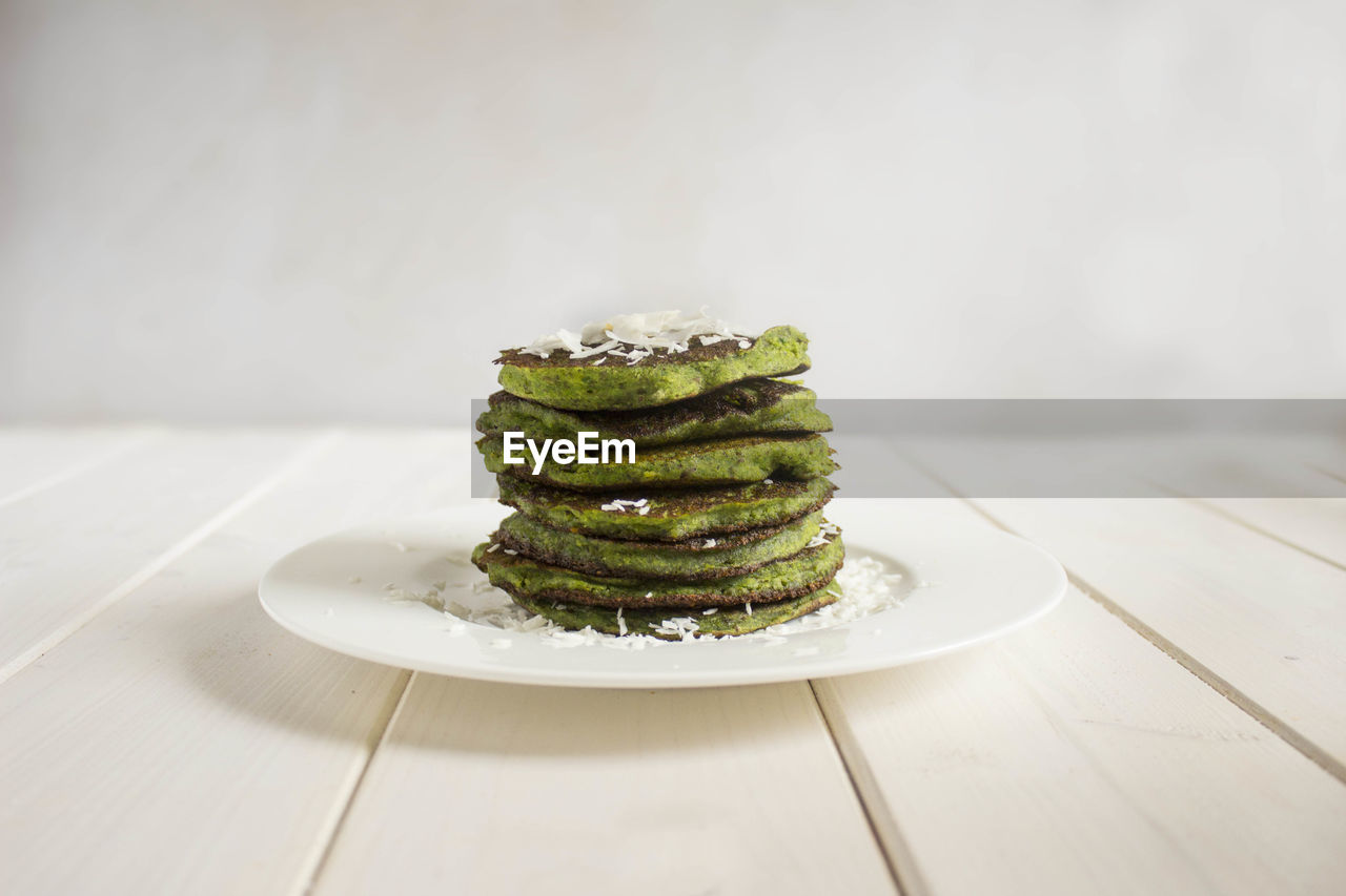 High angle view of pancakes in plate on table