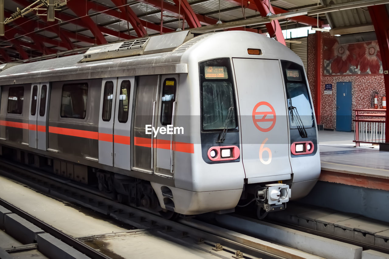 Delhi metro train arriving at jhandewalan metro station in new delhi, india,asia, public metro train