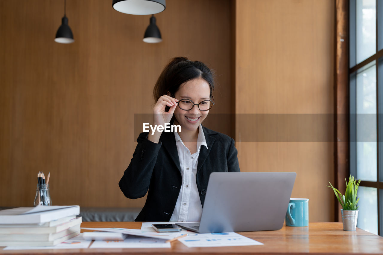 businesswoman working at desk in creative office