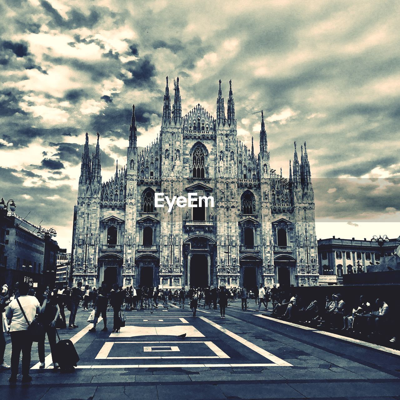 PEOPLE WALKING IN FRONT OF CATHEDRAL