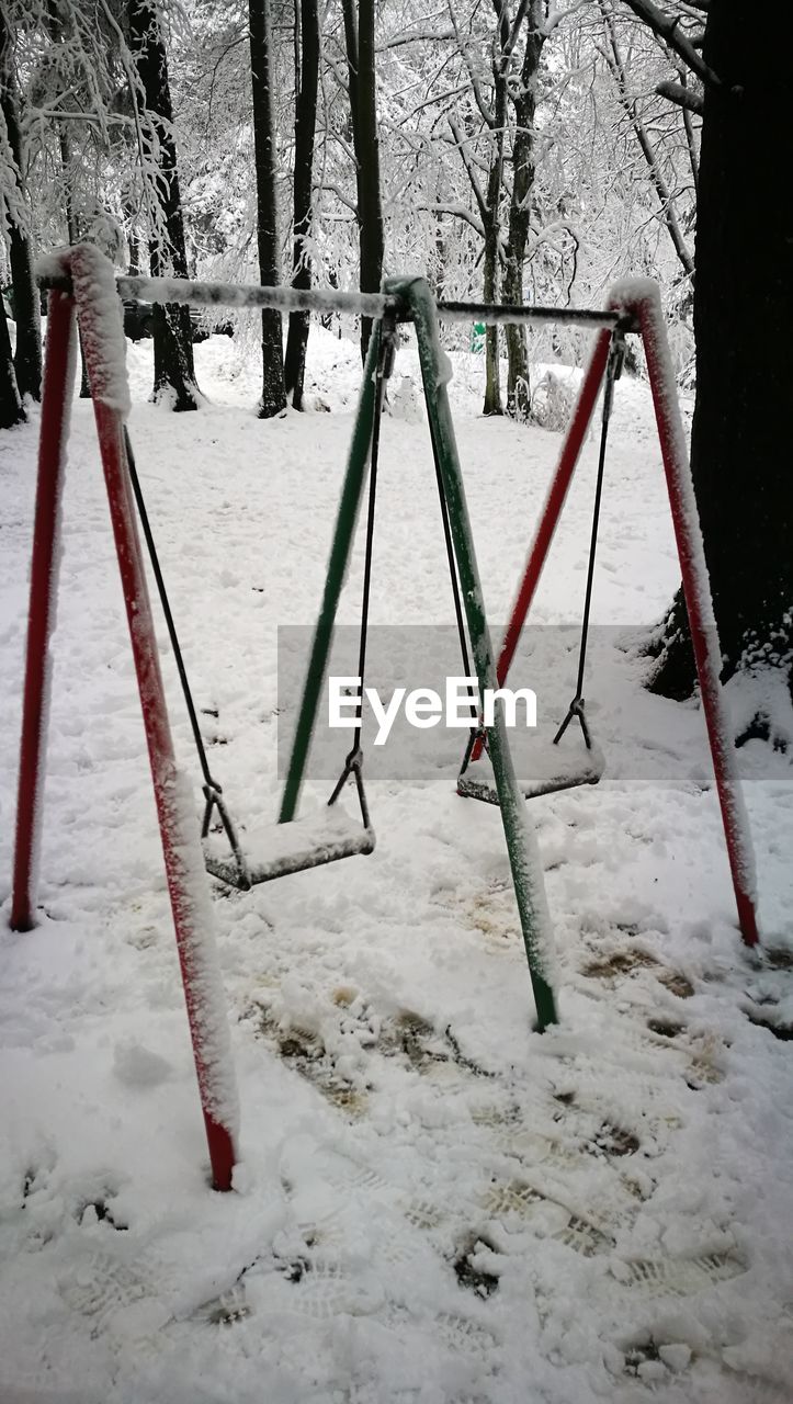 CLOSE-UP OF PLAYGROUND DURING WINTER