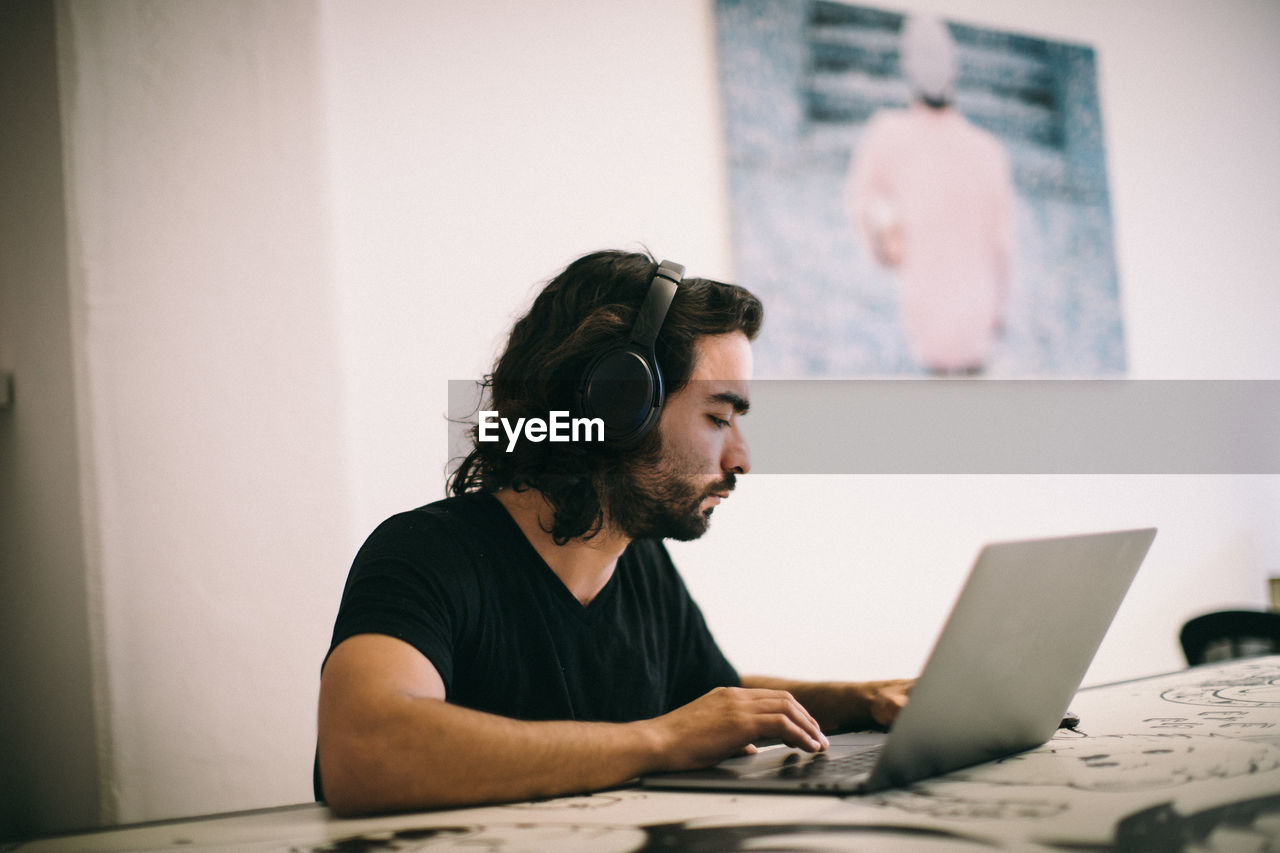 Man sitting on table at home