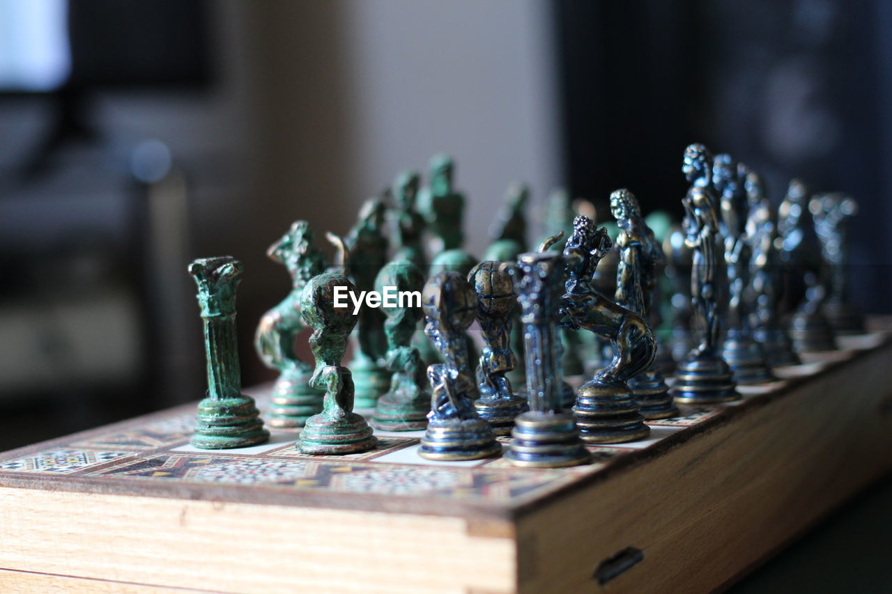 Close-up of chess pieces on book