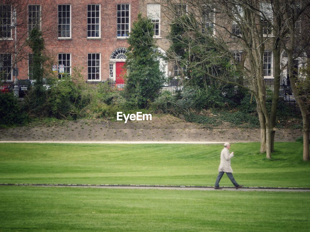 Side view of man walking in park