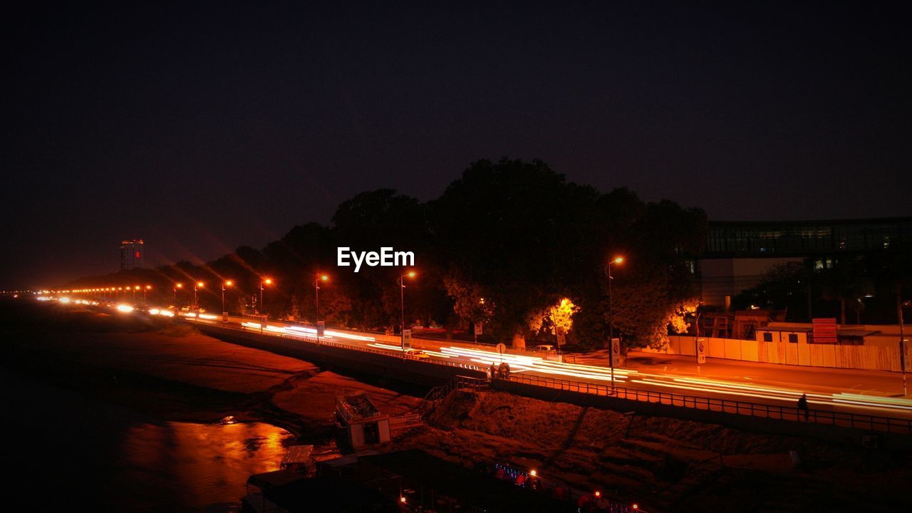 High angle view of illuminated street at night