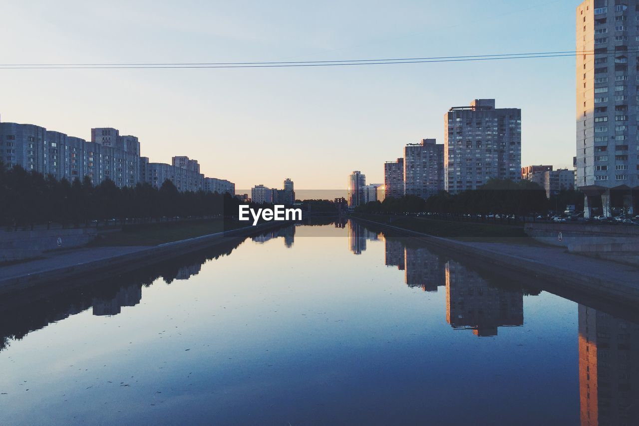 REFLECTION OF CITY IN WATER
