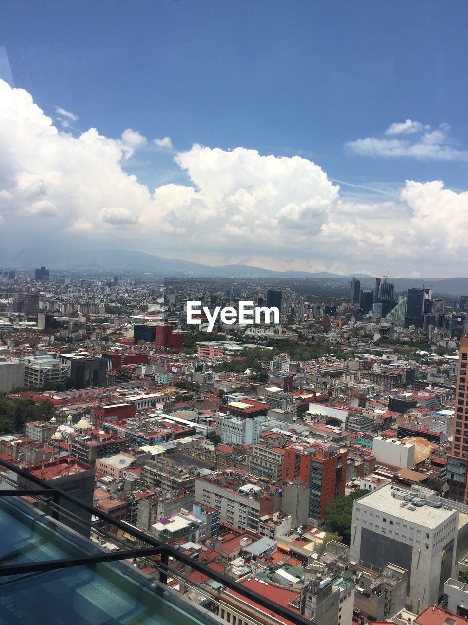 HIGH ANGLE VIEW OF BUILDINGS AGAINST SKY