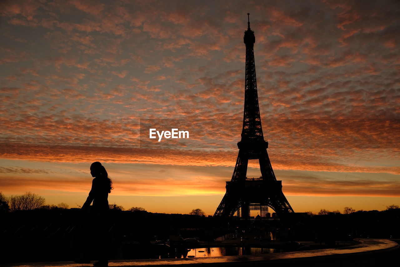sky, sunset, architecture, travel destinations, silhouette, evening, dusk, nature, built structure, cloud, tower, horizon, city, tourism, travel, orange color, afterglow, beauty in nature, reflection, water, history, the past, outdoors, dramatic sky, building exterior, memorial, sun, one person