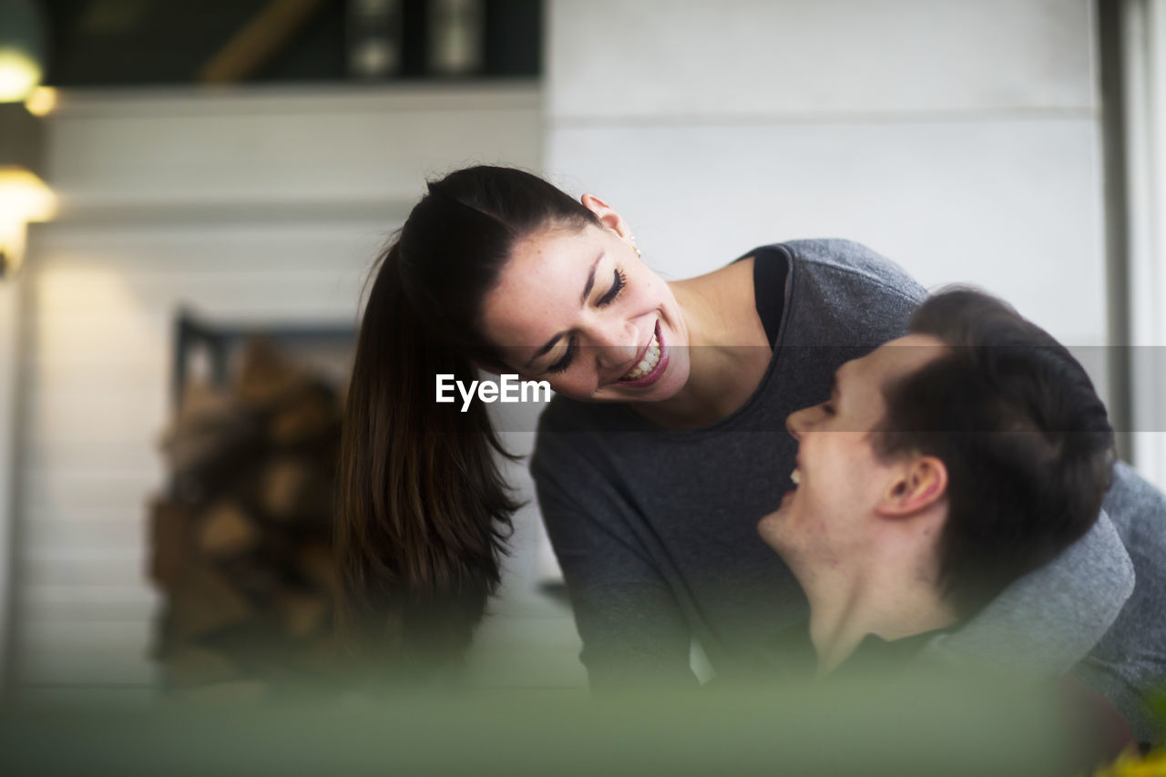 Young couple in a living room in love