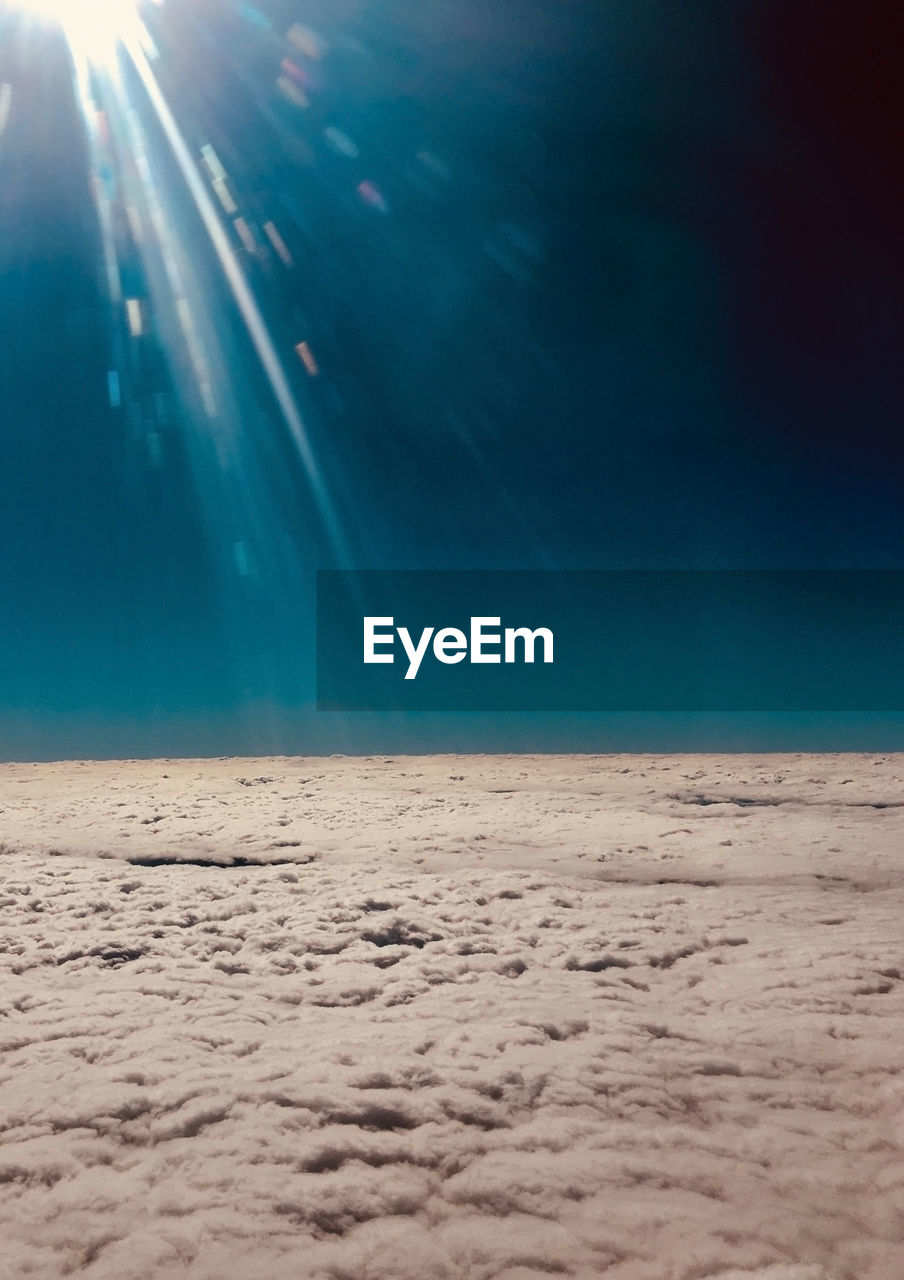 SCENIC VIEW OF BEACH AGAINST SKY ON SUNNY DAY