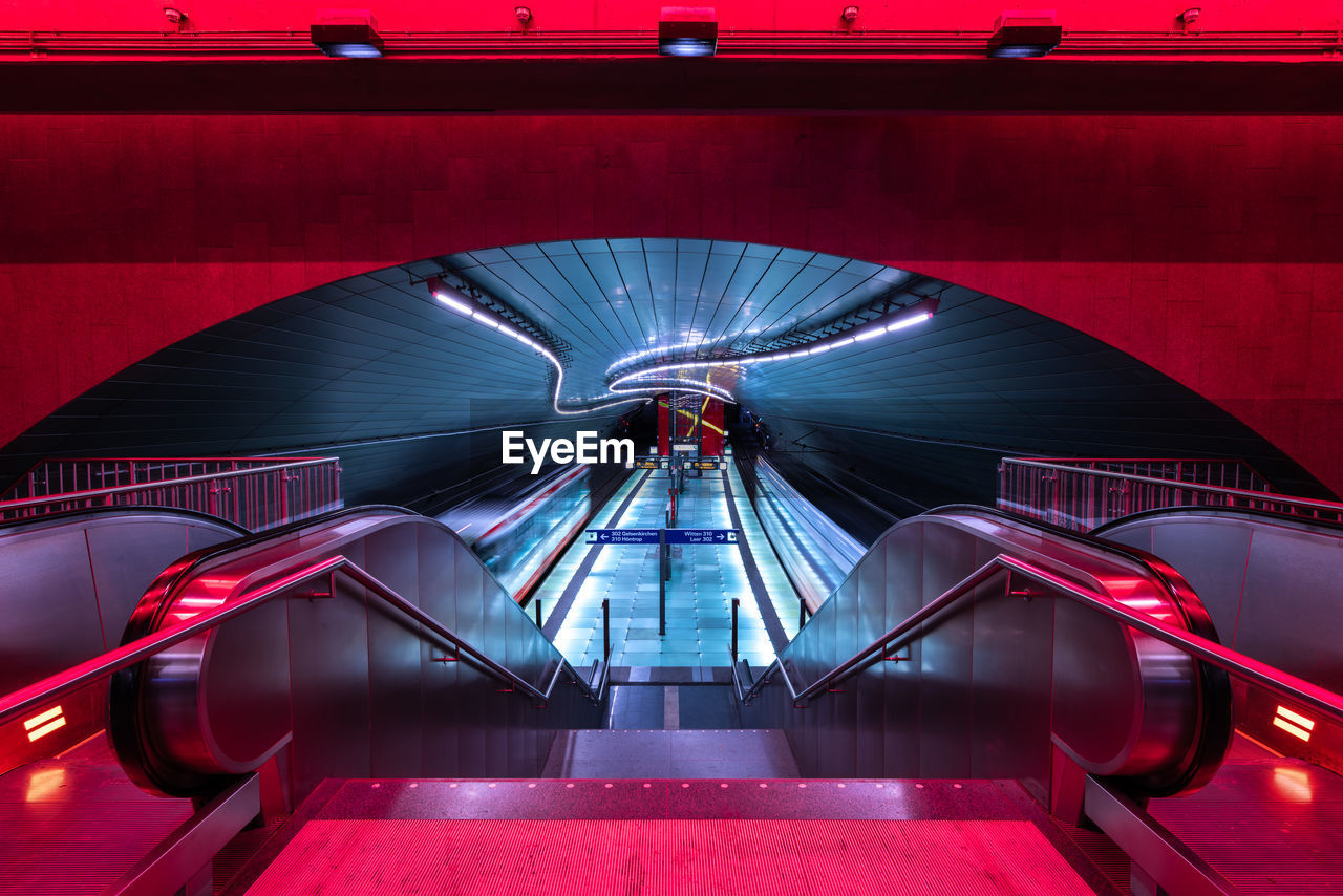 Illuminated escalator in tunnel