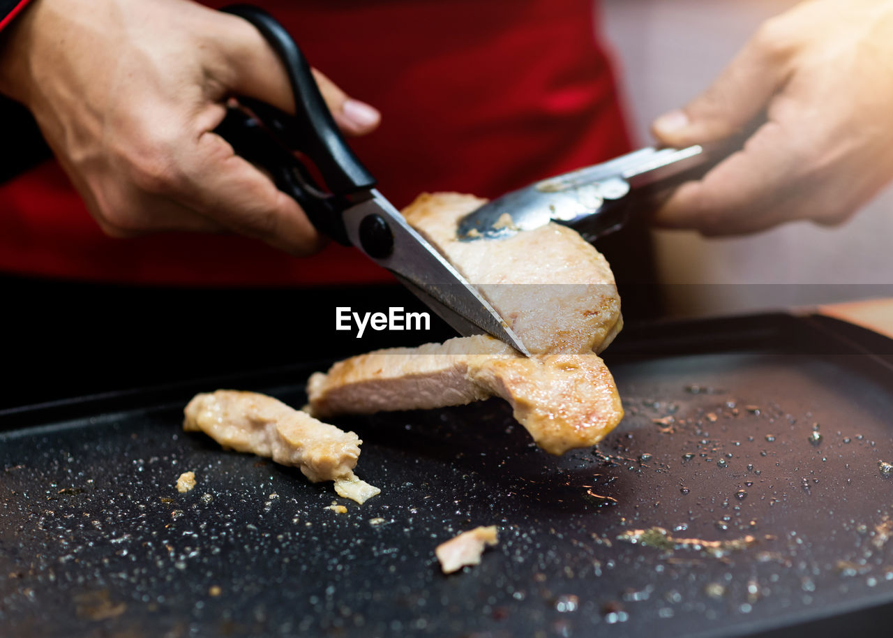 cropped hands of man preparing food