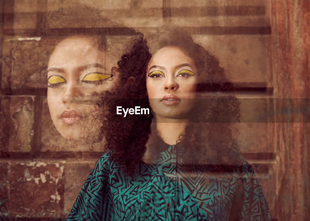 Double exposure of woman with yellow eyeshadow