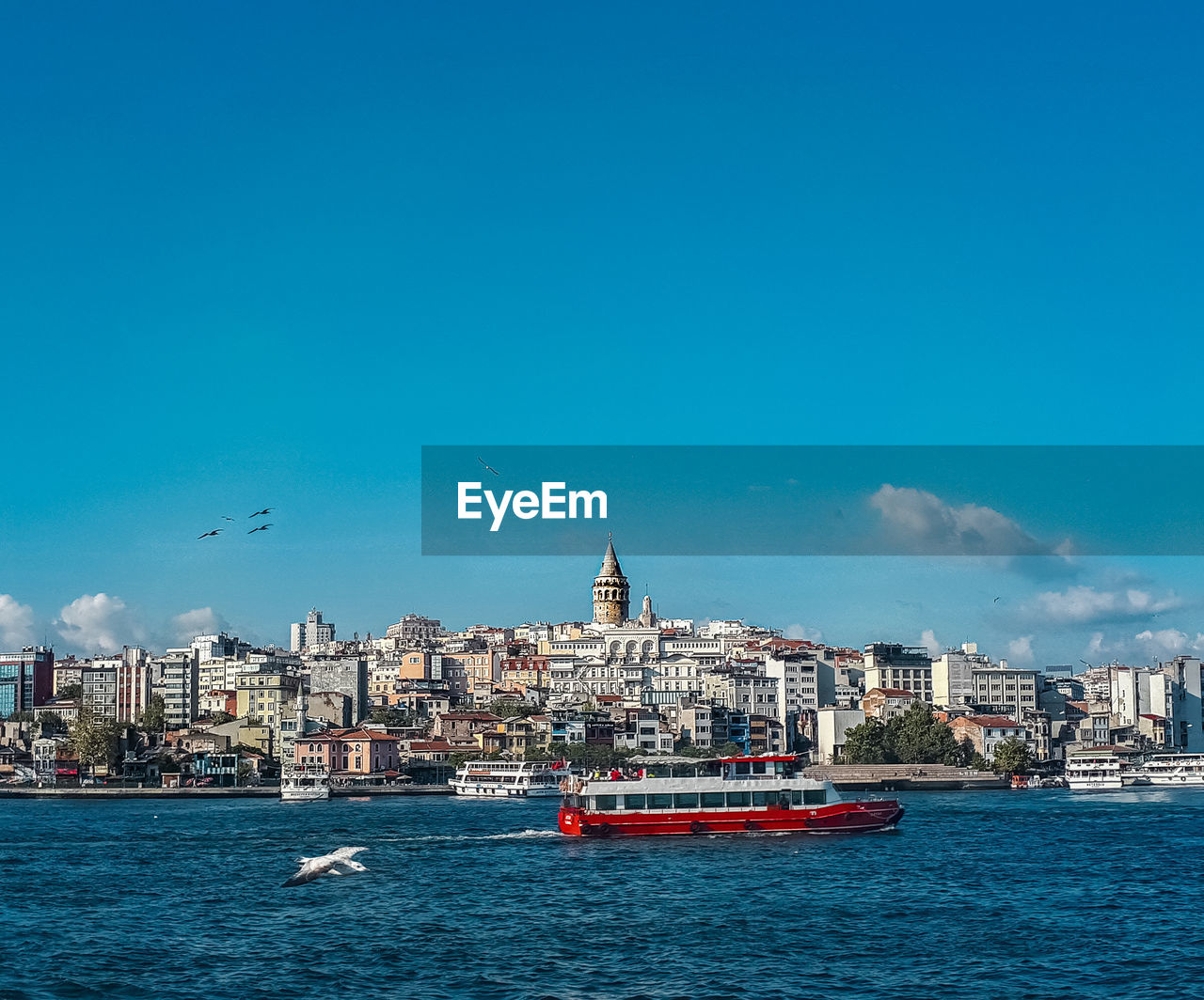 View of boats in sea against buildings