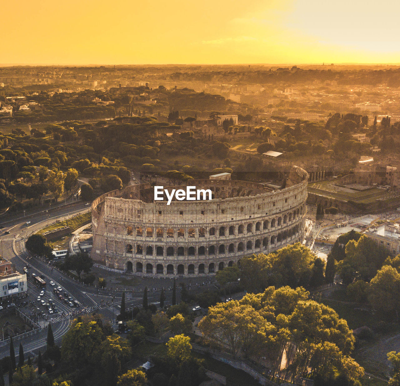 High angle view of coliseum during sunset in city