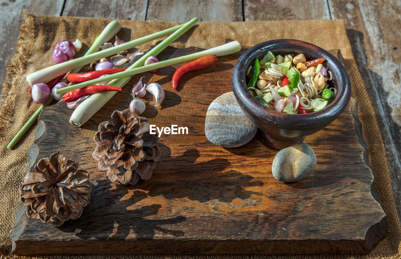 HIGH ANGLE VIEW OF CHOPPED VEGETABLES ON TABLE