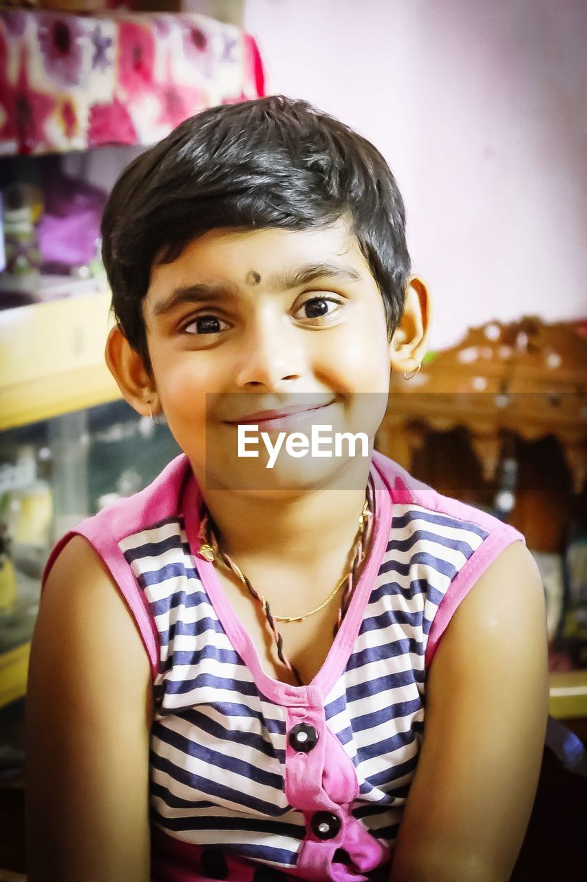 Portrait of smiling girl at home