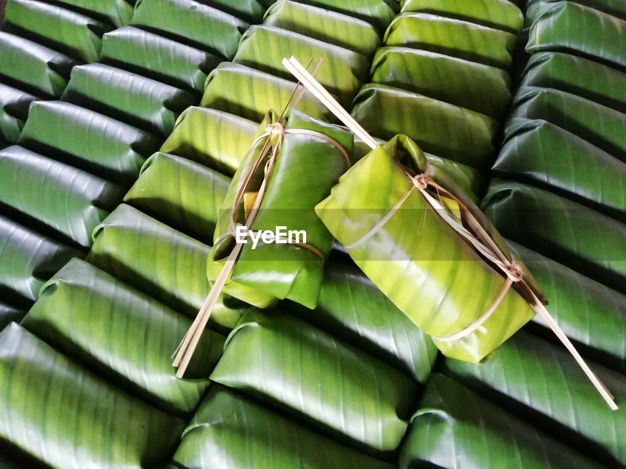 High angle view of food tied in green leaves