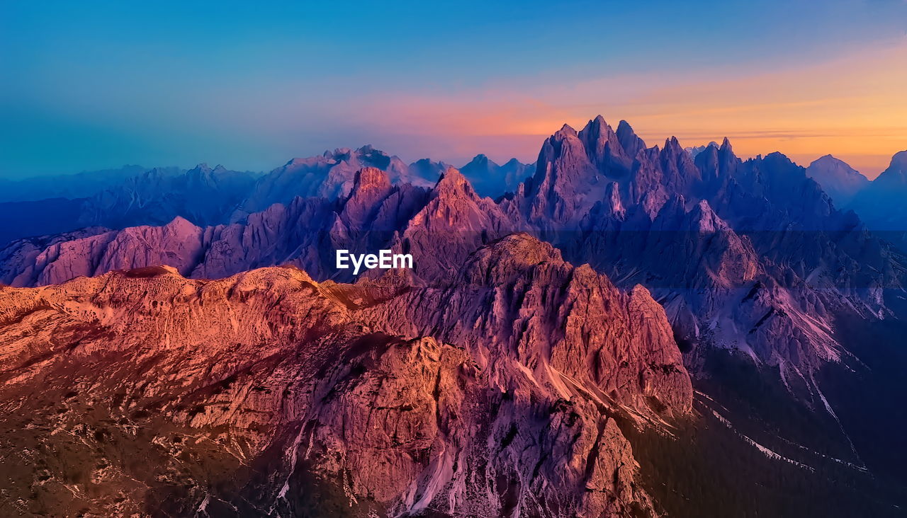 Panoramic view of rock formations against sky during sunset