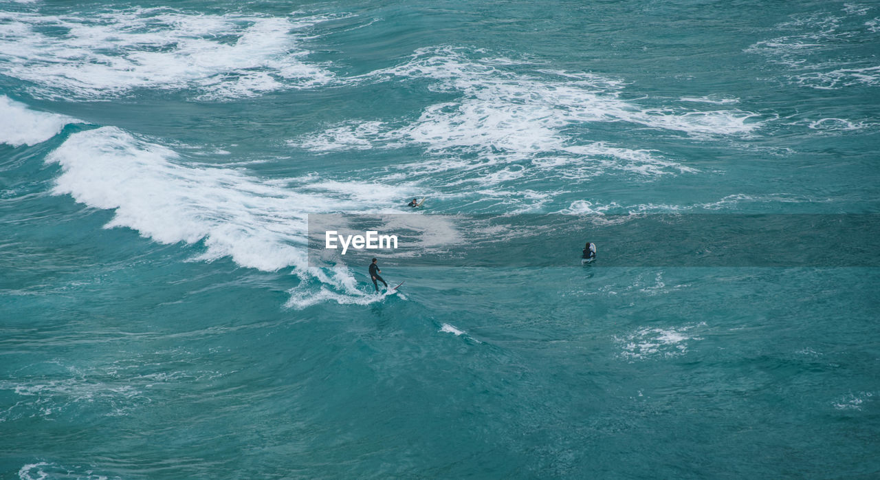 High angle view of man surfing on sea