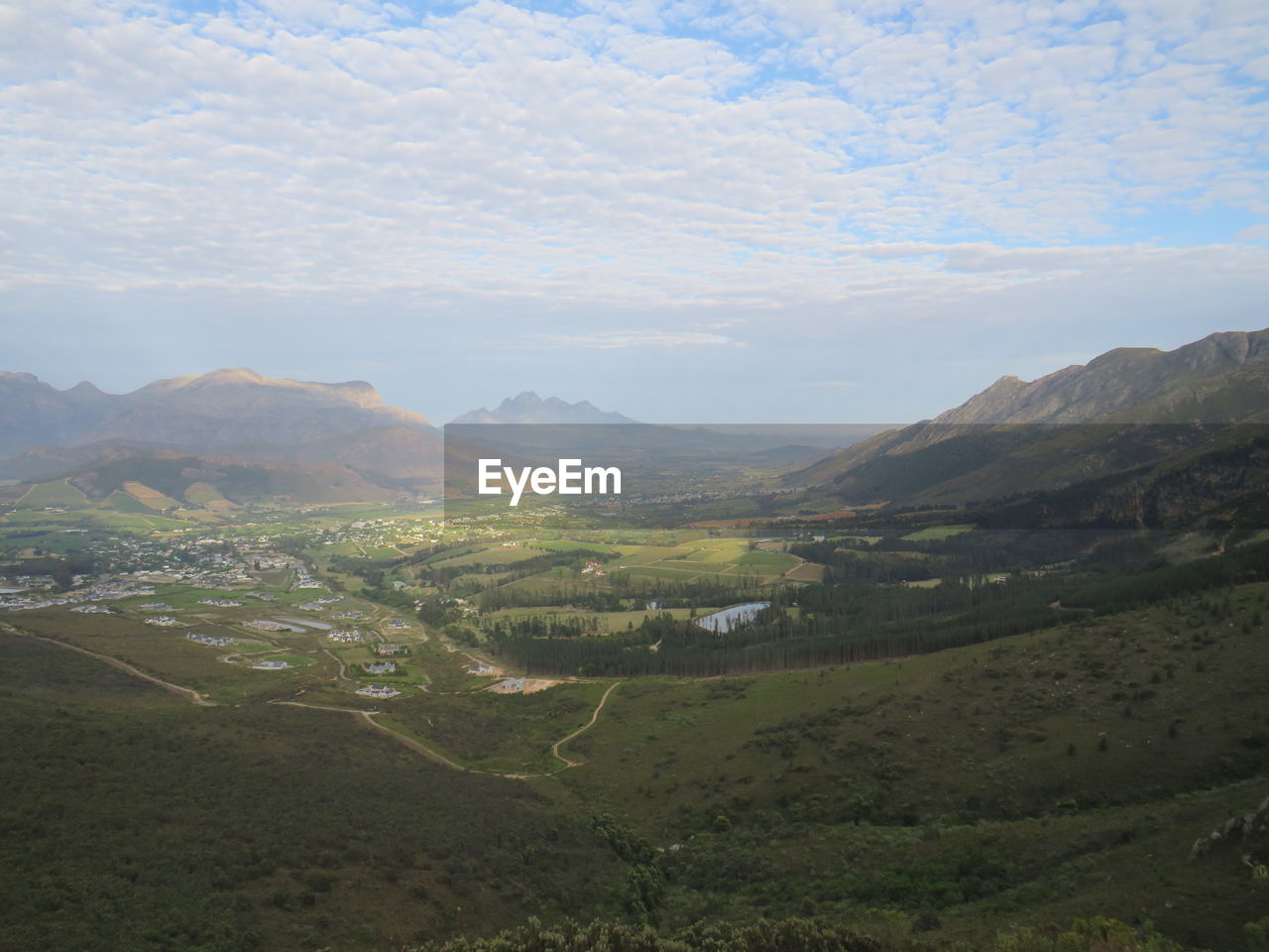 Scenic view of landscape and mountains against sky