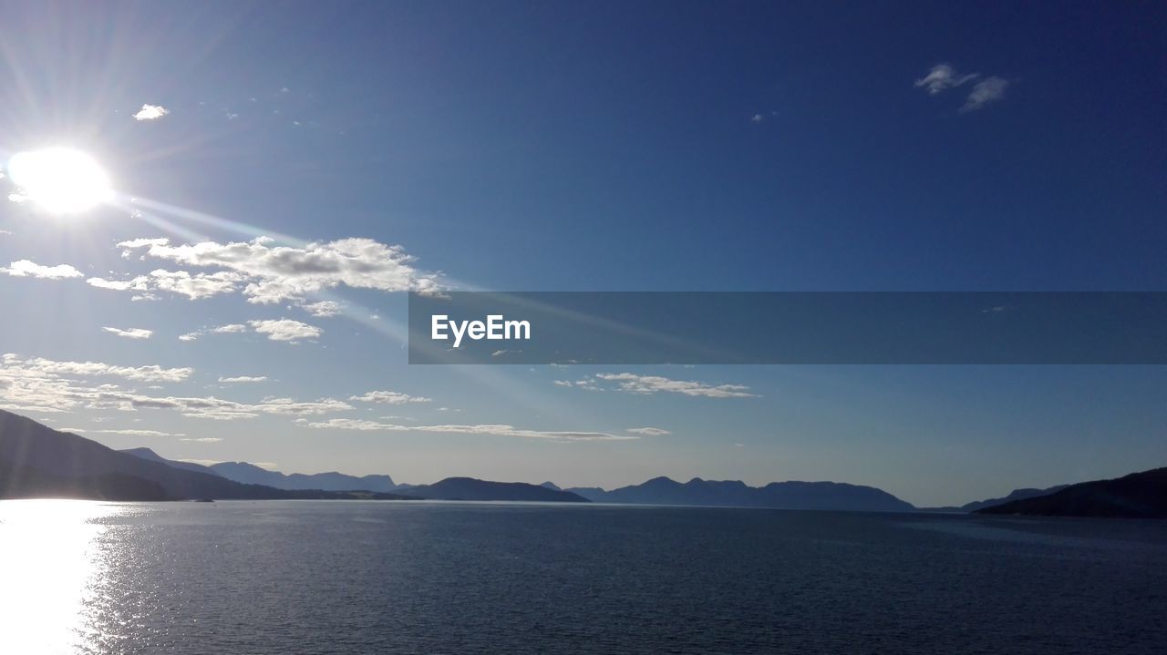 SCENIC VIEW OF LAKE AGAINST MOUNTAINS