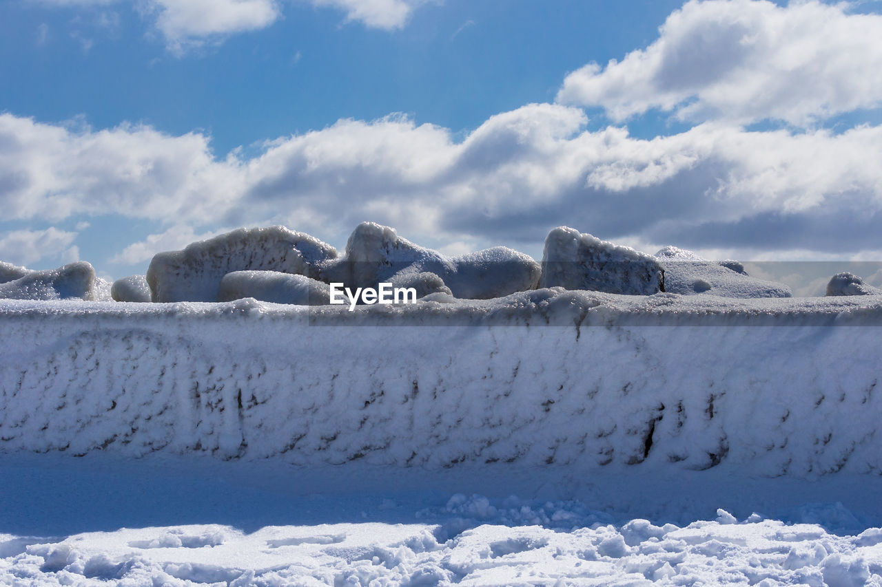 Scenic view of frozen lake against sky