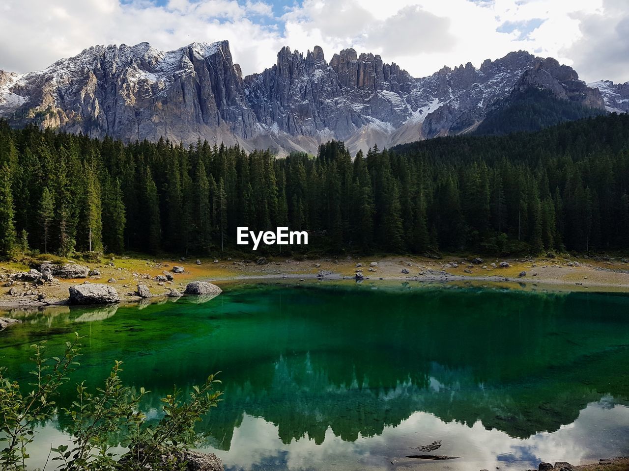 Scenic view of lake and mountains against sky