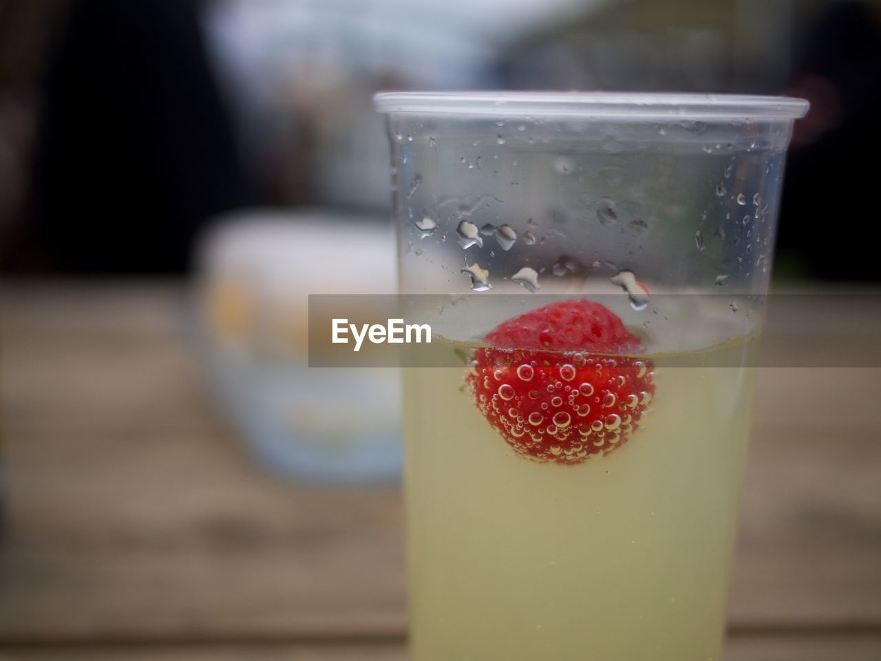 Close-up of strawberry in drink on table