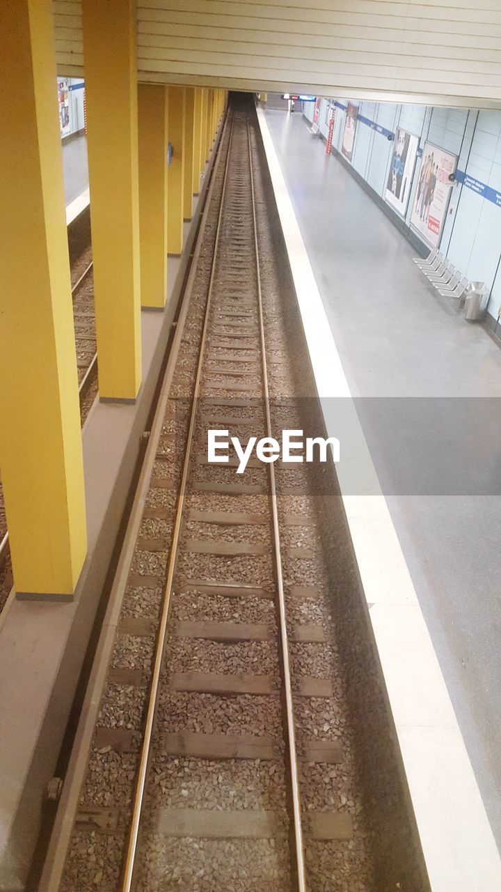 RAILROAD TRACKS AT STATION PLATFORM