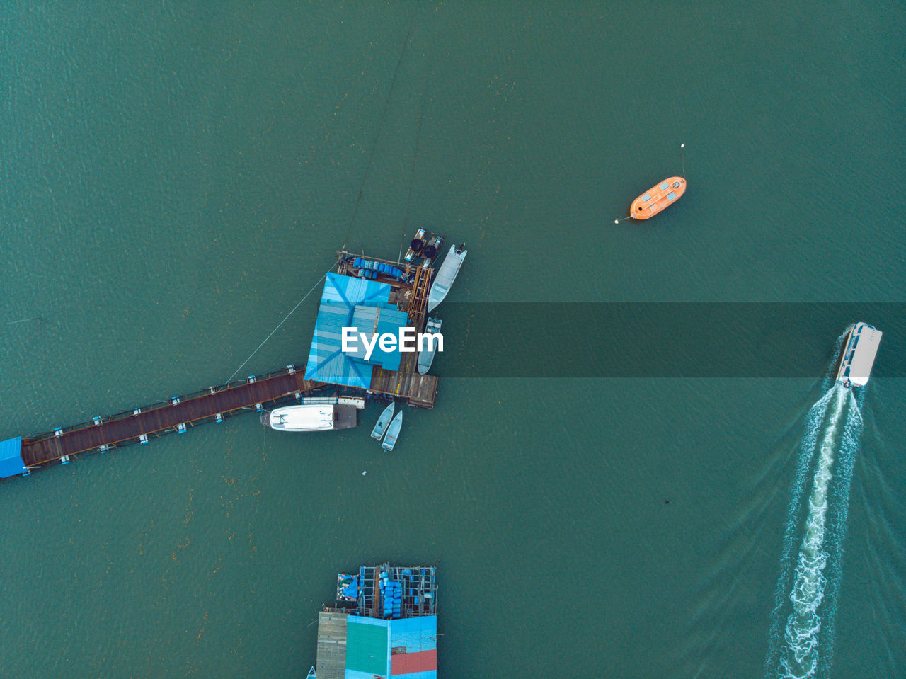 High angle view of ship on pier over sea