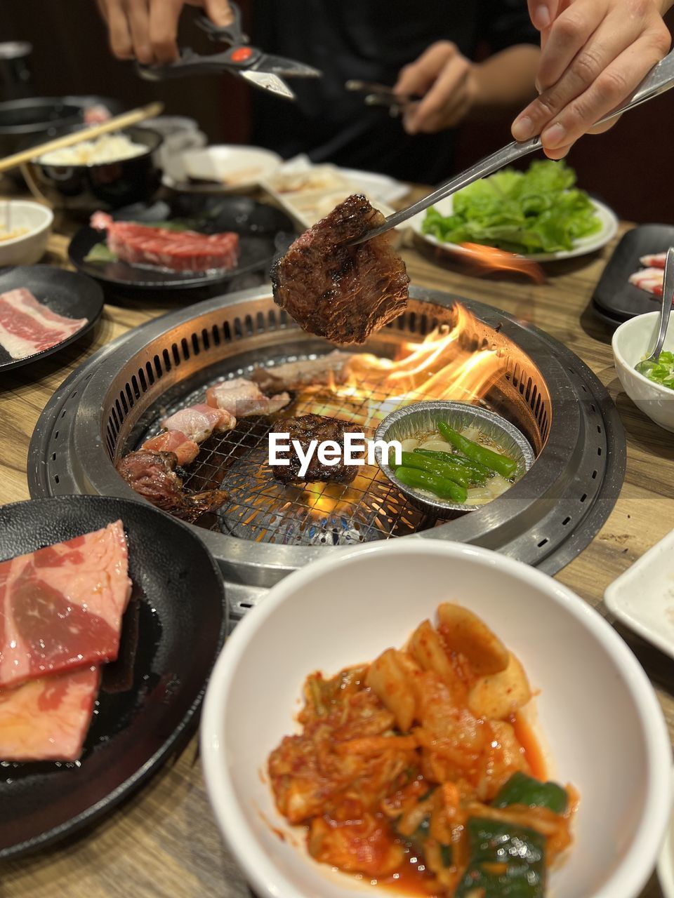 cropped hand of person preparing food on table