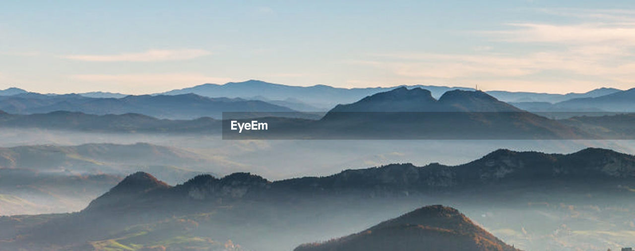 Scenic view of mountains against sky at morning