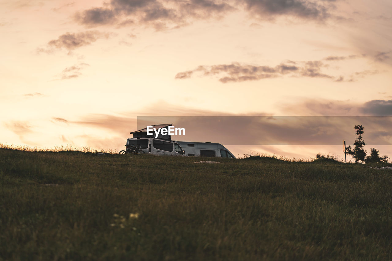 Scenic view of field against sky during sunset