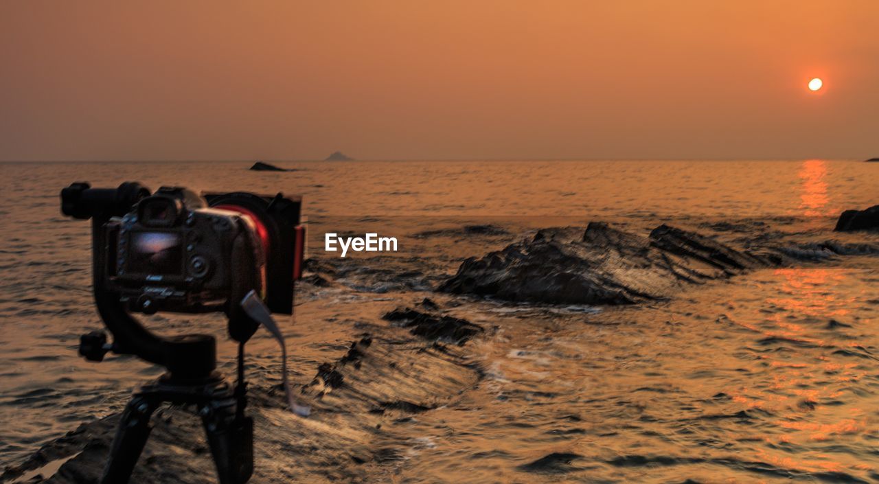 SCENIC VIEW OF SEA DURING SUNSET