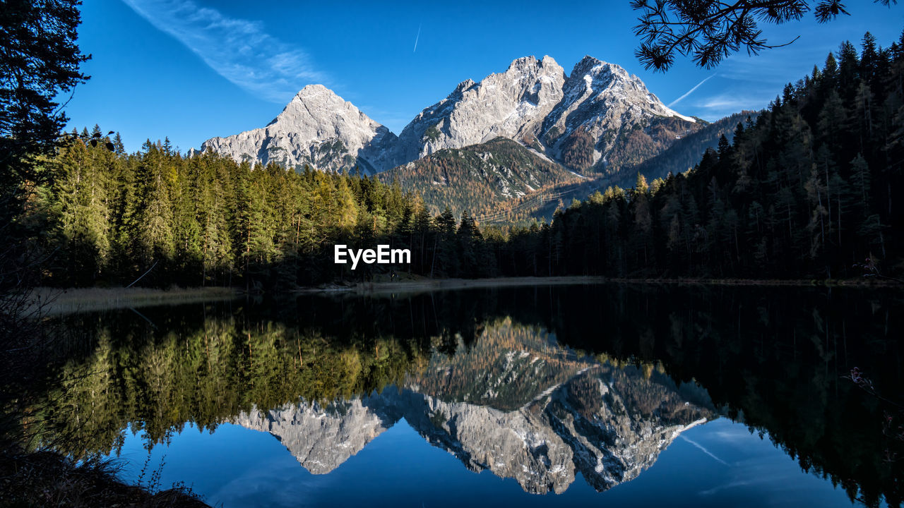 Mirror image of sonnenspitze and marienbergspitzen in mitersee