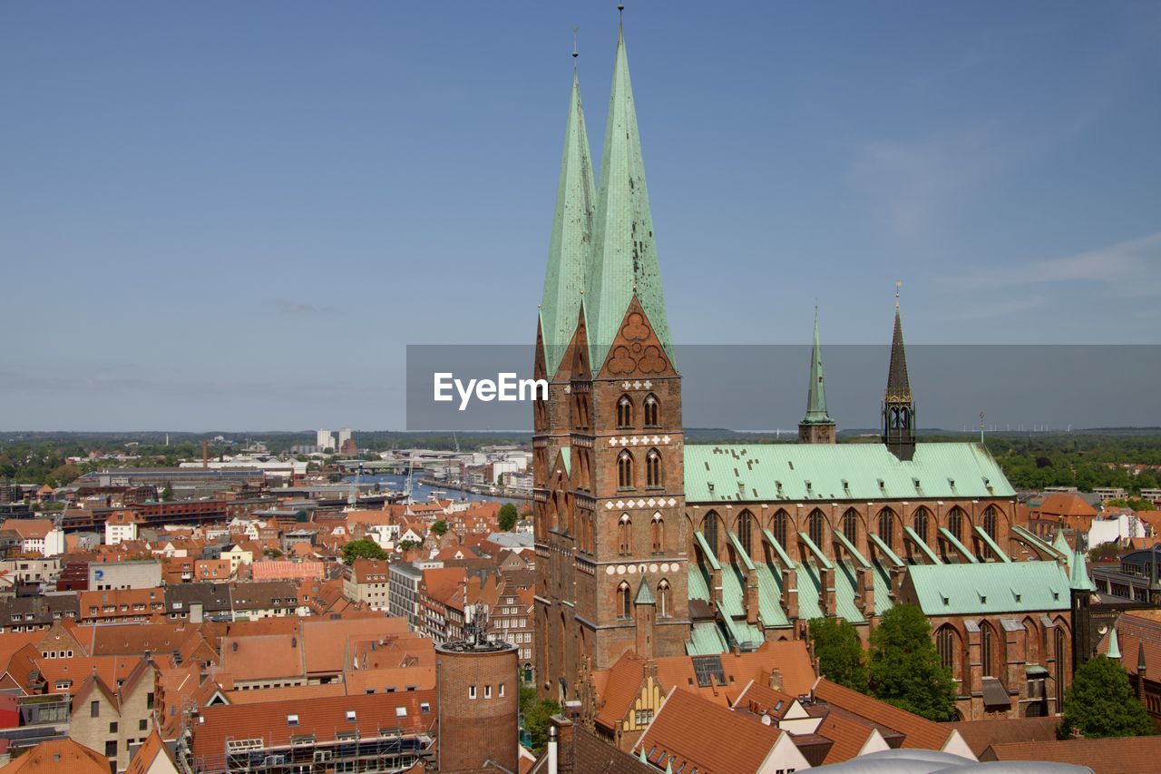 high angle view of buildings in city against sky