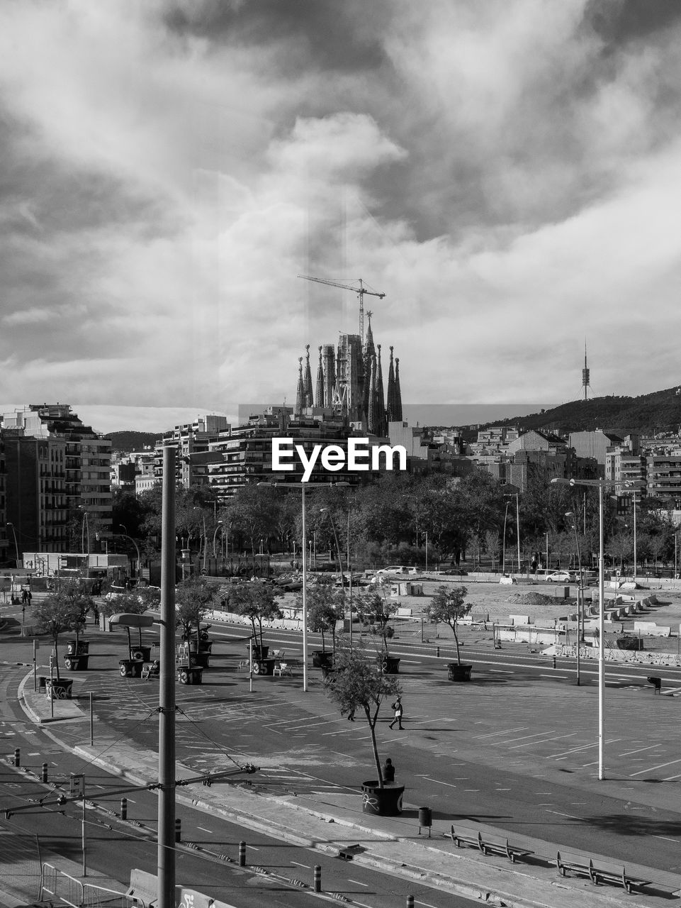 cityscape, architecture, urban area, city, black and white, built structure, monochrome, building exterior, sky, monochrome photography, skyline, cloud, street, road, transportation, nature, building, downtown, residential area, mode of transportation, skyscraper, travel destinations, outdoors, day, infrastructure, car, metropolis, city life, travel, city street, no people, motor vehicle