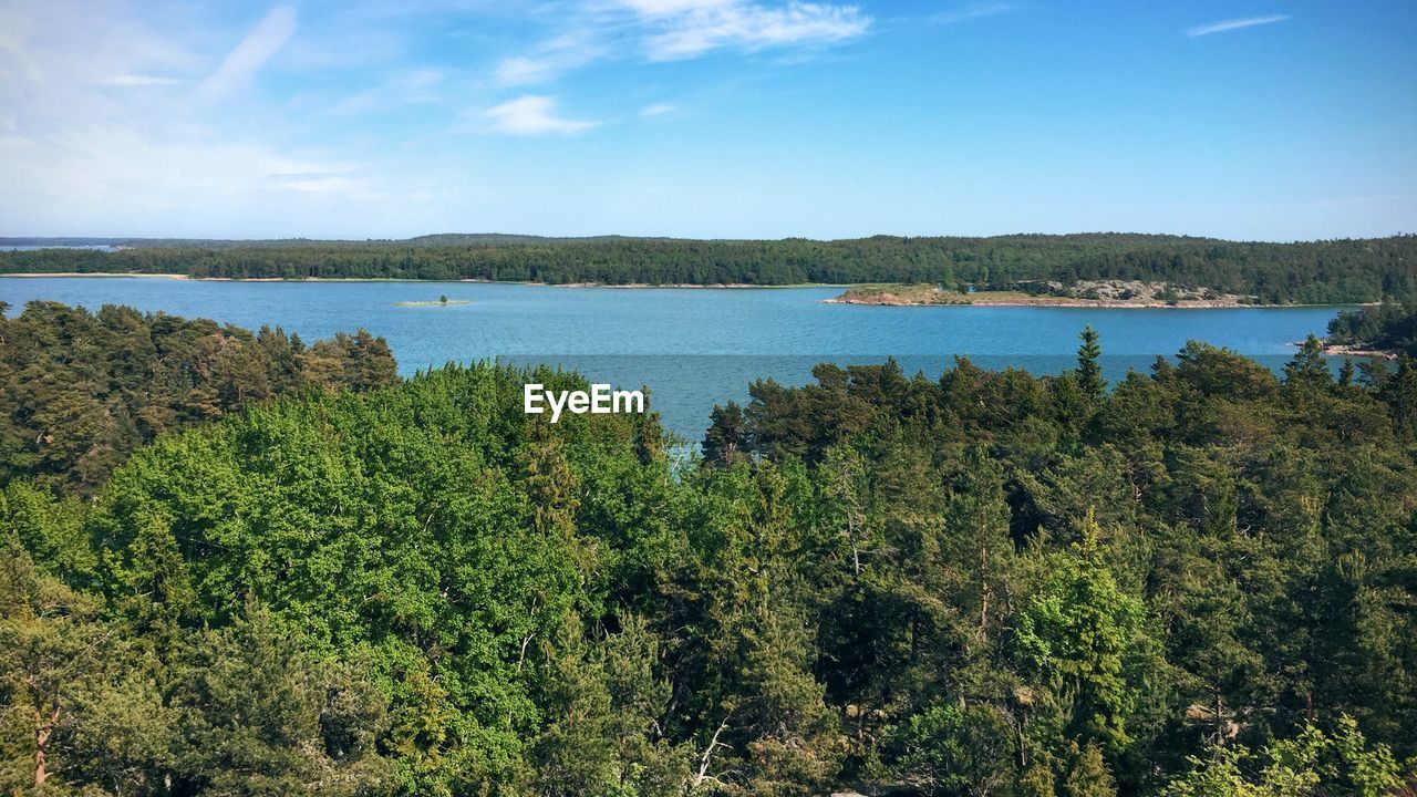 Scenic view of landscape against cloudy sky