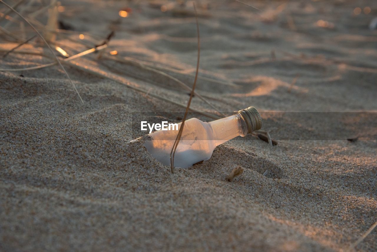 Bottle on sandy beach