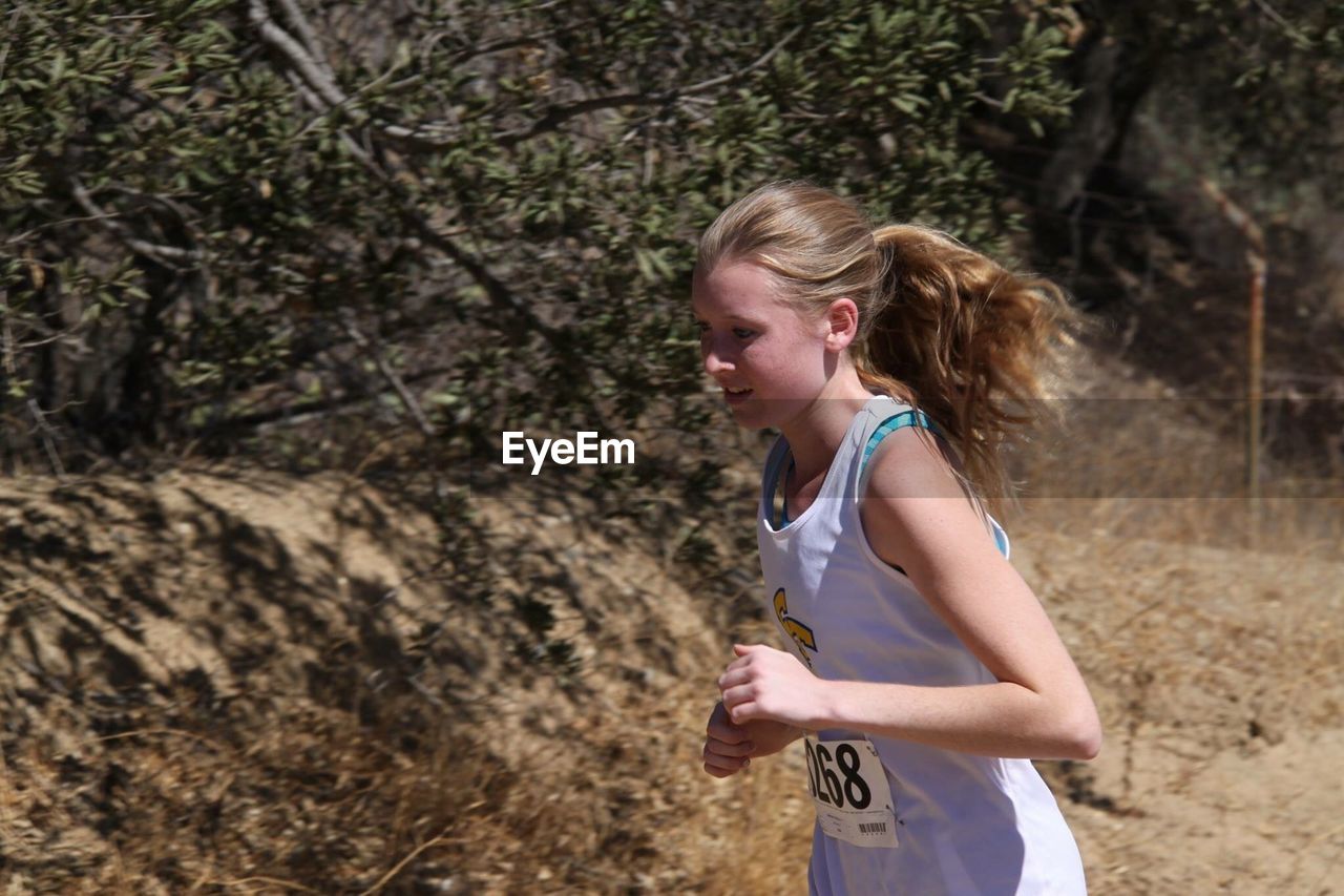 Teenage girl running marathon