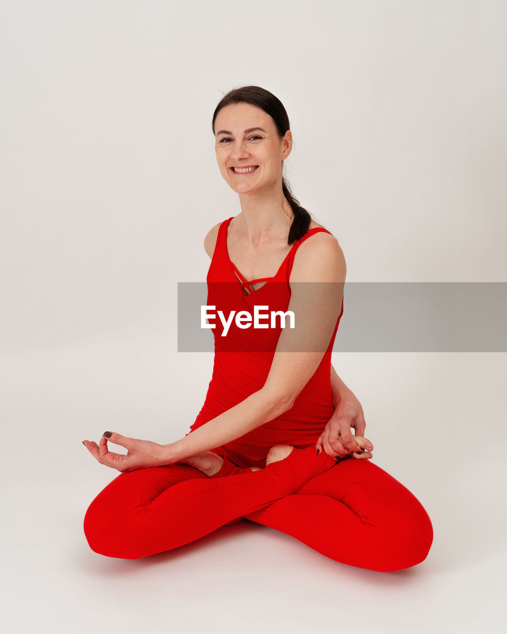 portrait of young woman sitting on floor