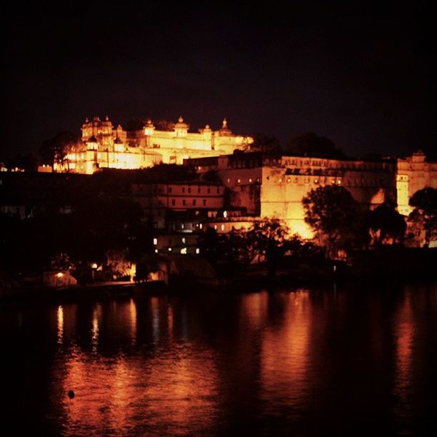 VIEW OF ILLUMINATED BUILDINGS AT NIGHT