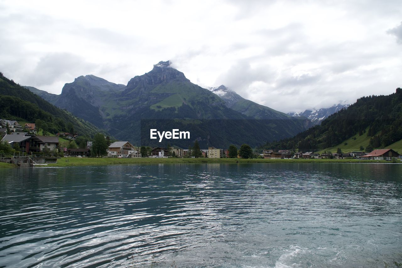 SCENIC VIEW OF LAKE AND MOUNTAINS