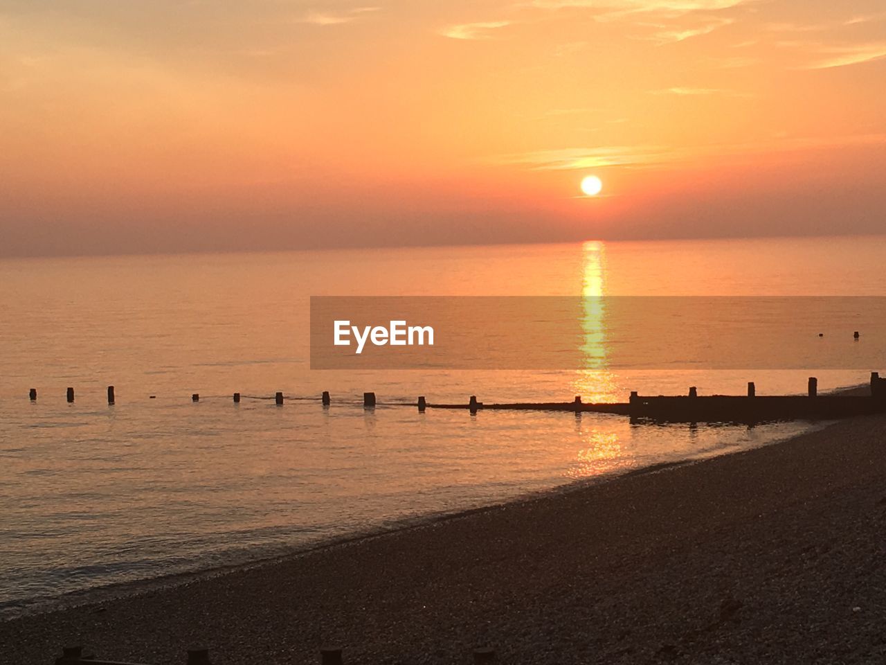 SCENIC VIEW OF SEA DURING SUNSET