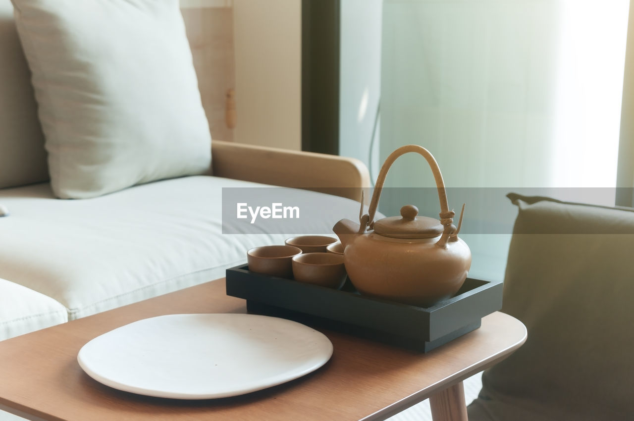 TEA CUP ON TABLE AT HOME