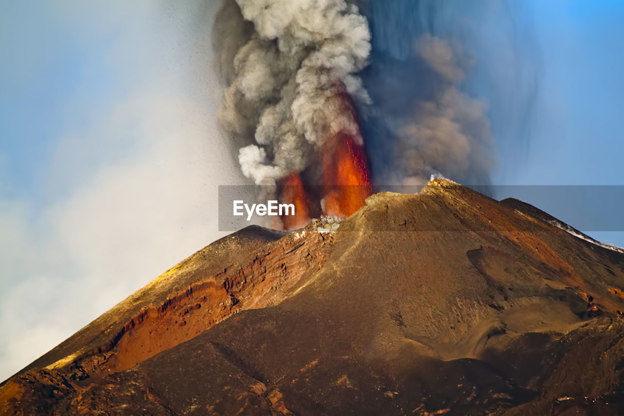 Scenic view of volcanic mountain against sky