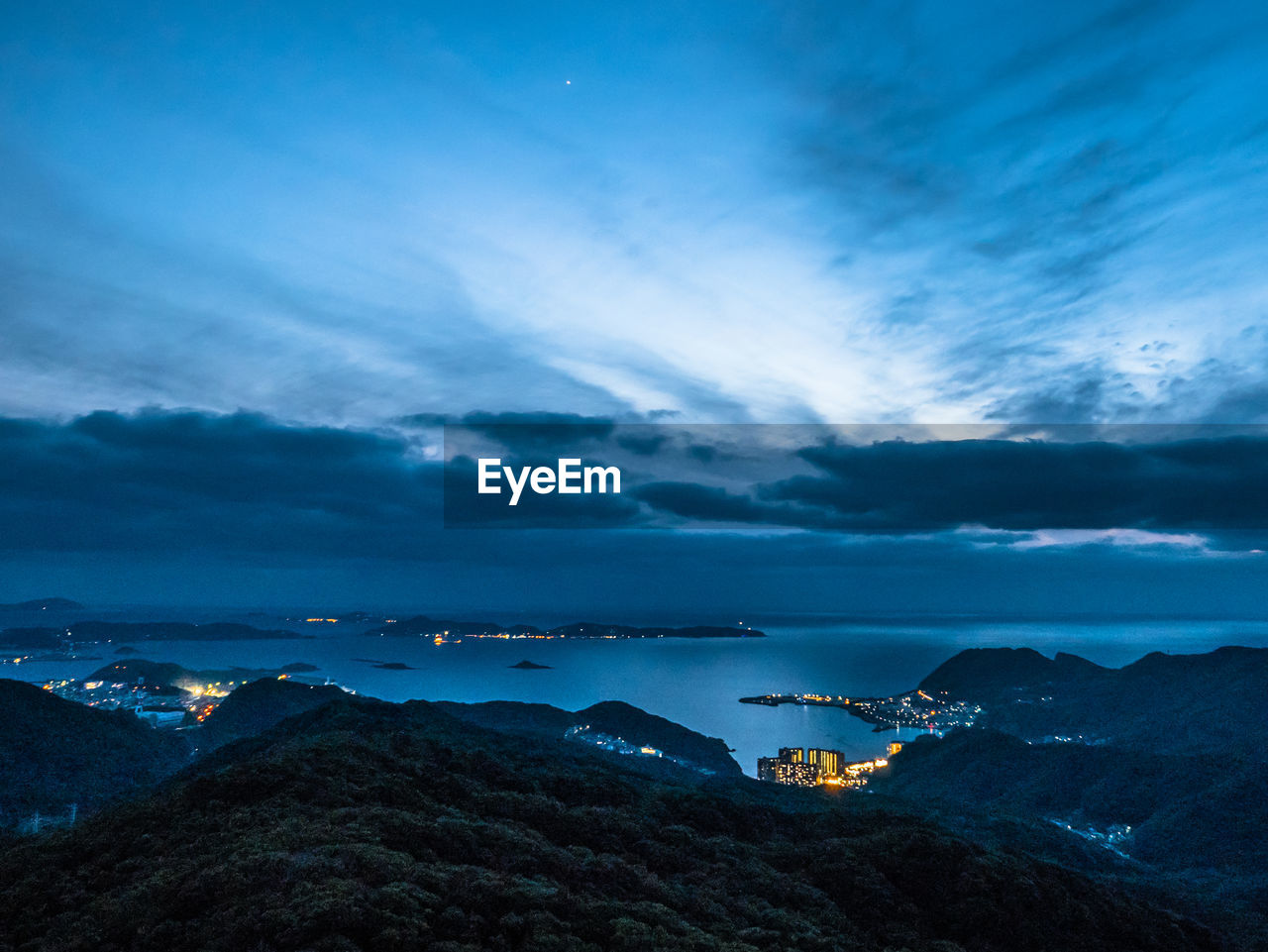 Scenic view of sea against sky at night